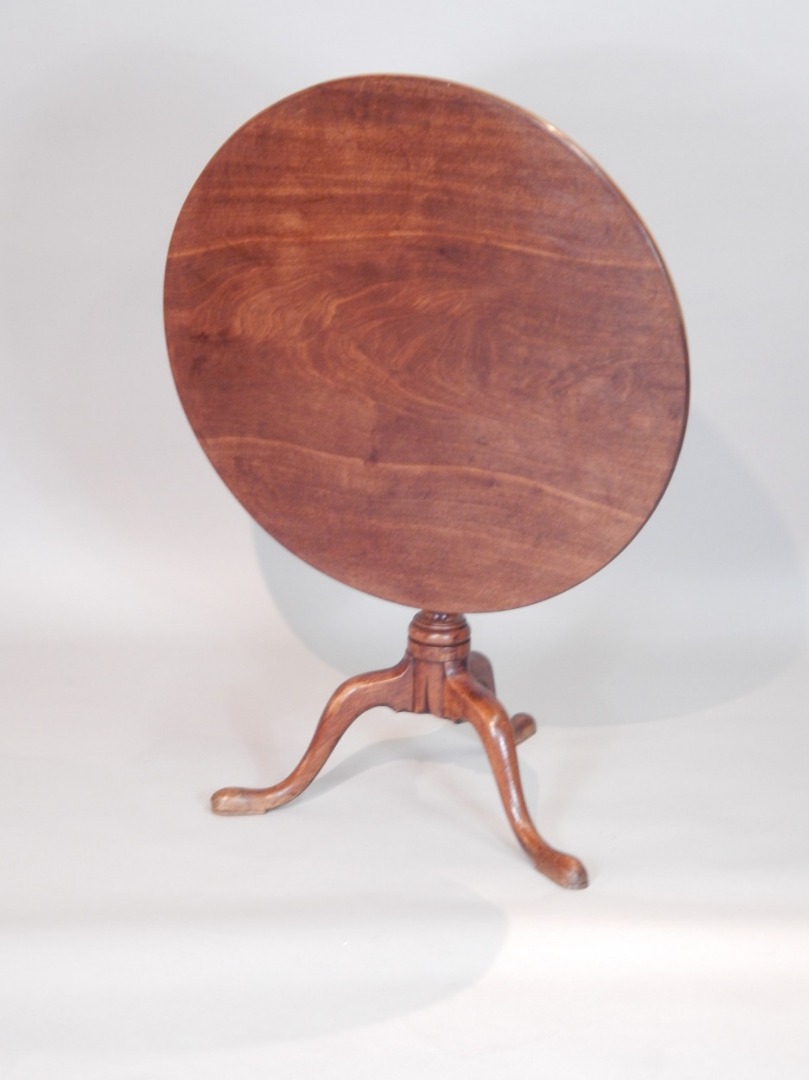 Appraisal: A George III mahogany tilt top table the circular top