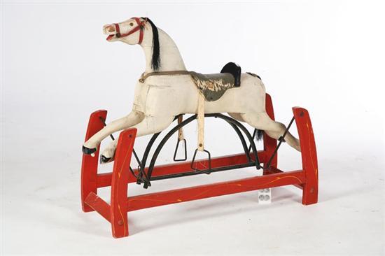 Appraisal: ROCKING HORSE American early th century hardwood Carved horse with