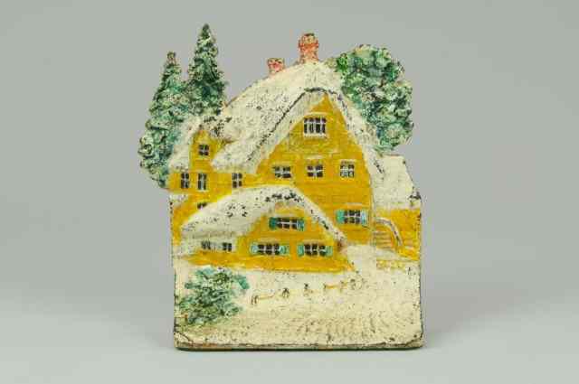 Appraisal: SNOW CAPPED COTTAGE DOORSTOP Book Example charming yellow house covered