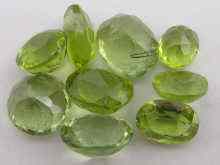 Appraisal: Nine loose polished peridots largest approx x mm Approx carats