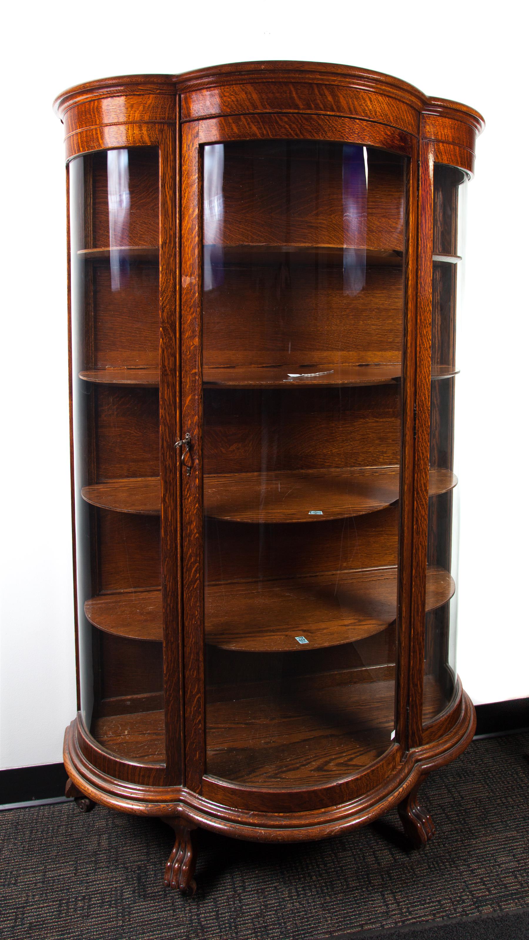 Appraisal: CURVED GLASS CHINA CABINET American st quarter- th century oak