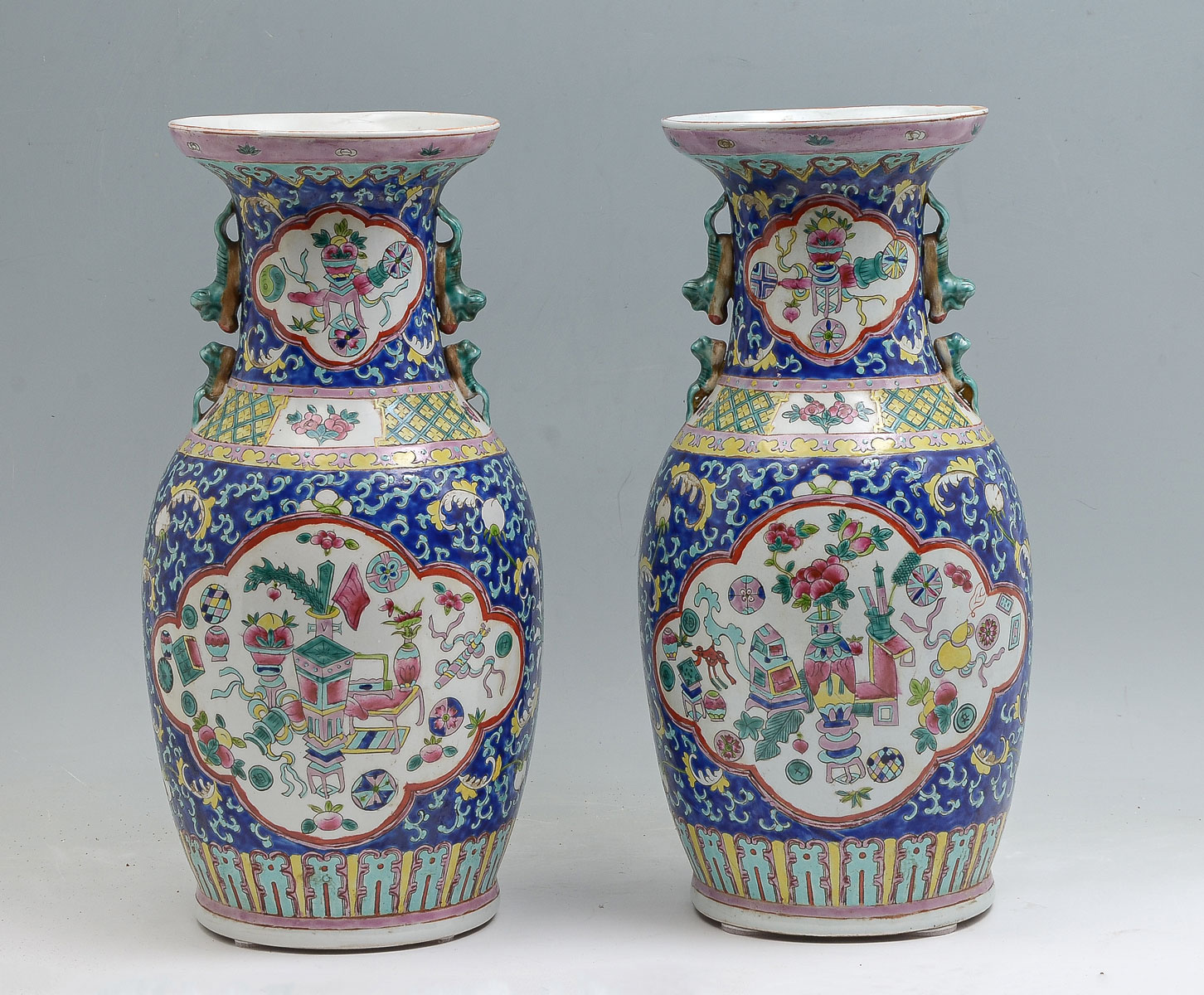 Appraisal: PAIR OF BLUE GROUND SCHOLARLY FAMILLE ROSE VASES Pair of