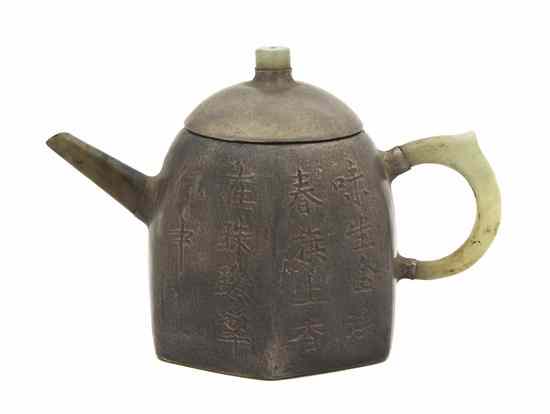 Appraisal: A Chinese Teapot having a silvered body with jade handles