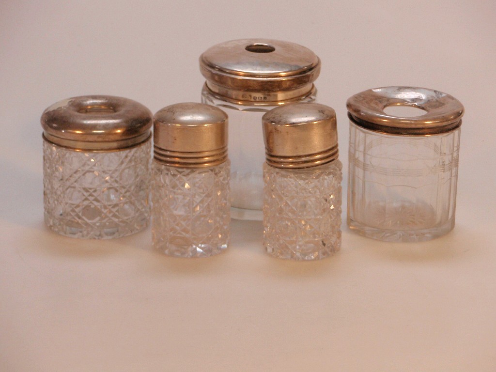 Appraisal: Five cut glass dressing table bottles with silver tops various