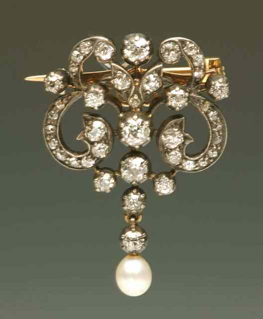 Appraisal: A VICTORIAN DIAMOND AND PEARL SET BROOCH CUM PENDANT old