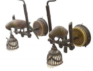 Appraisal: PAIR OF PATINATED BRONZE BIRD SCONCES Each with basket weave