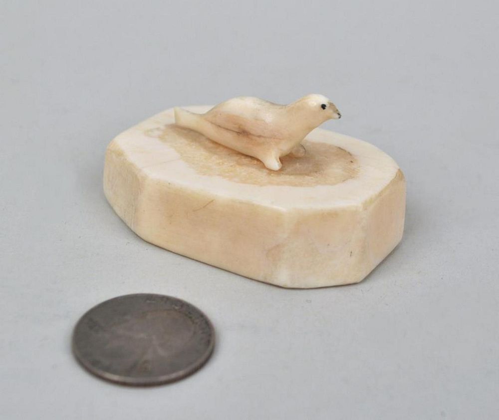 Appraisal: Inuit Bone Carving of Seal On Ice high wide Age