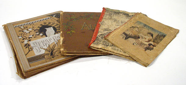 Appraisal: Four Victorian scrap albums including Negro advertising figures Christmas scenes