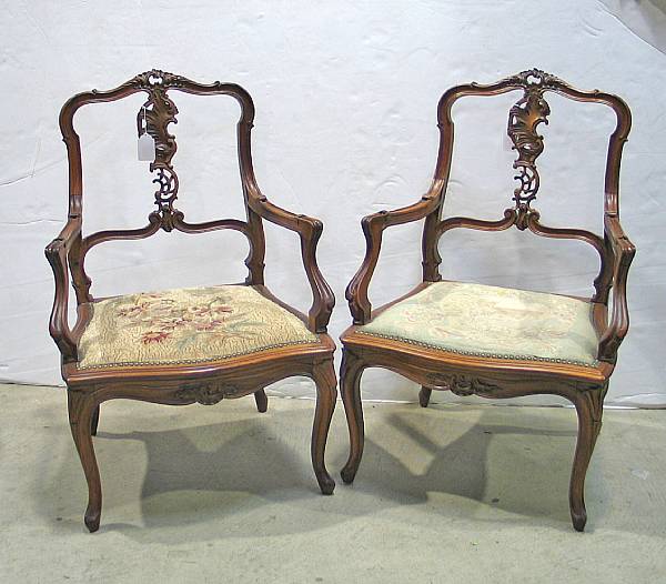 Appraisal: A pair of Louis XV walnut armchairs late th century