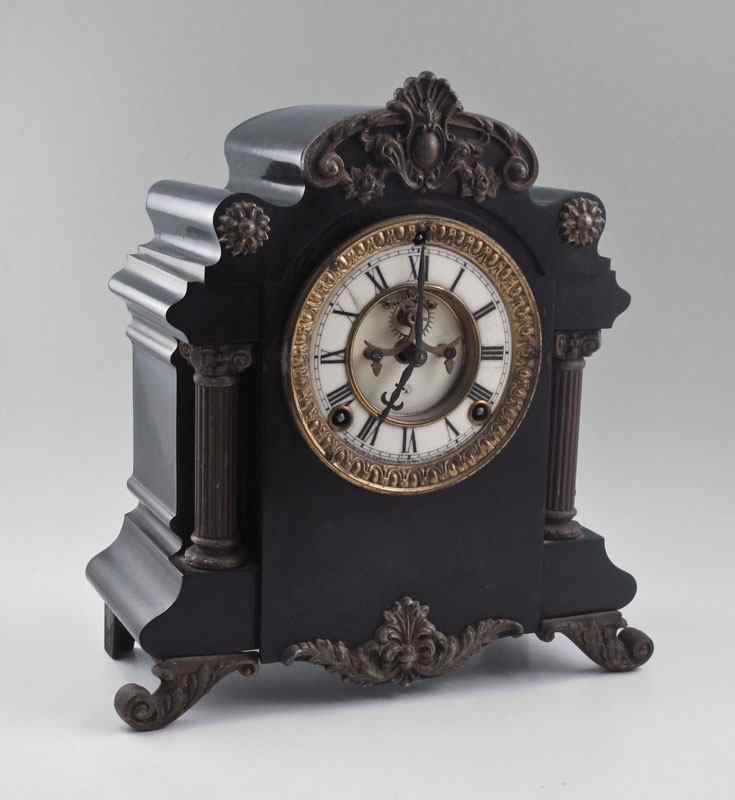 Appraisal: CAST METAL ANSONIA MANTLE CLOCK Cast metal case applied decoration