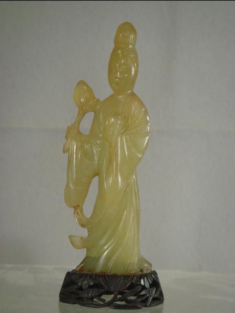 Appraisal: Light green carved jade Quan Yin figure hardwood base h