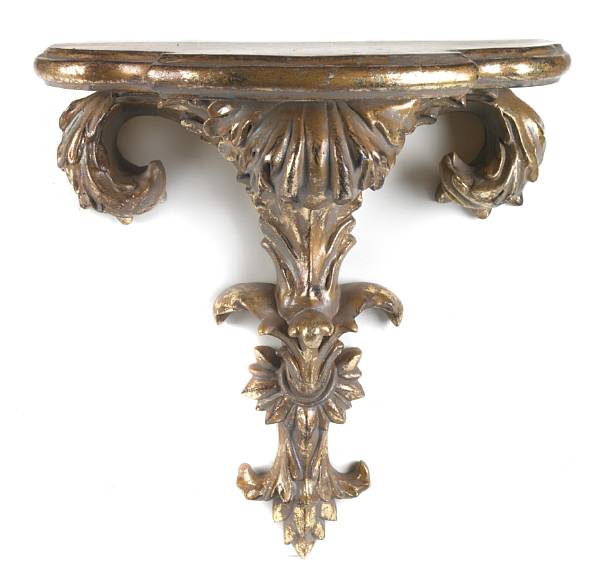 Appraisal: A pair of Italian Baroque style giltwood wall brackets height