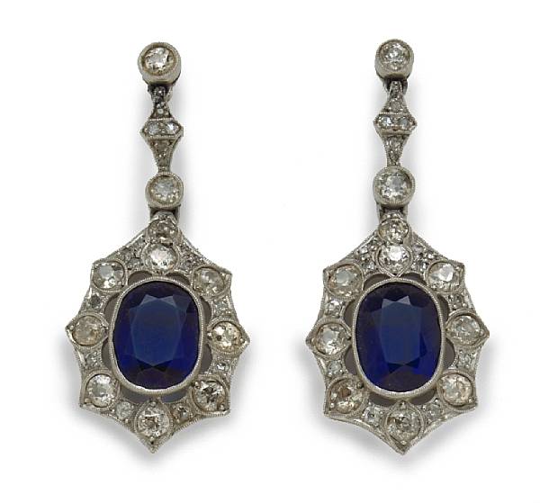 Appraisal: A pair of diamond and blue stone pendant earrings estimated