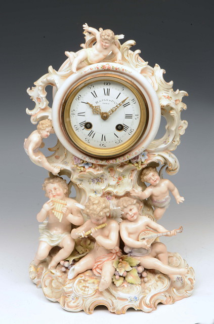 Appraisal: A FRENCH PORCELAIN MANTEL CLOCK the striking mechanism with circular