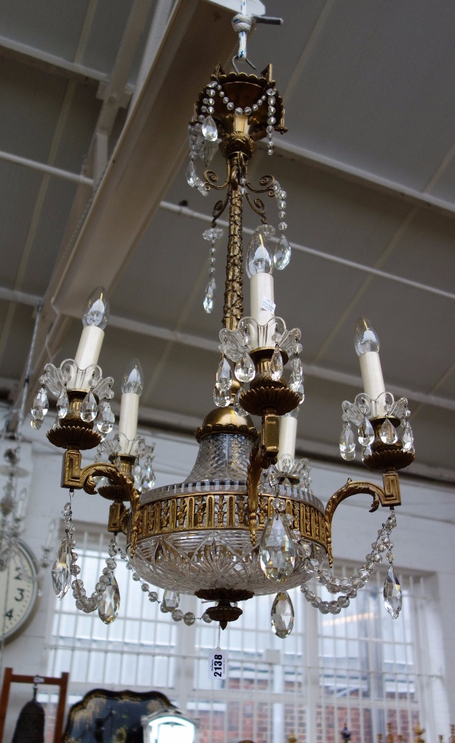 Appraisal: A gilt brass and glass mounted five branch chandelier th