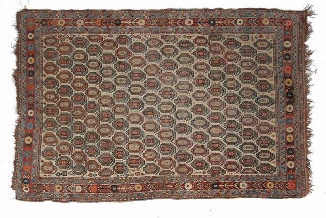 Appraisal: AN ANTIQUE PERSIAN RUG decorated numerous rows of guls on