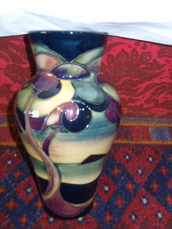 Appraisal: A Moorcroft vase of baluster shaped form with stylised landscape