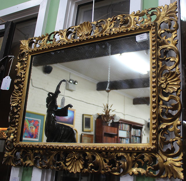 Appraisal: A TH CENTURY GILT FRAMED CARVED WOOD MIRROR with scrolling