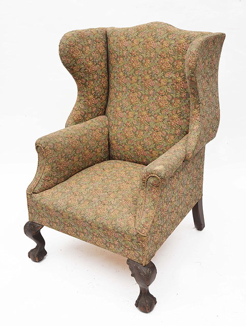 Appraisal: A TH CENTURY MAHOGANY WING BACK ARMCHAIR the shaped legs