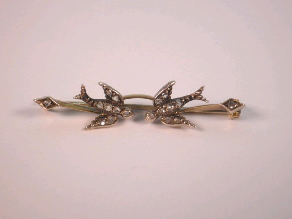 Appraisal: A double swift bar brooch set with diamond chips