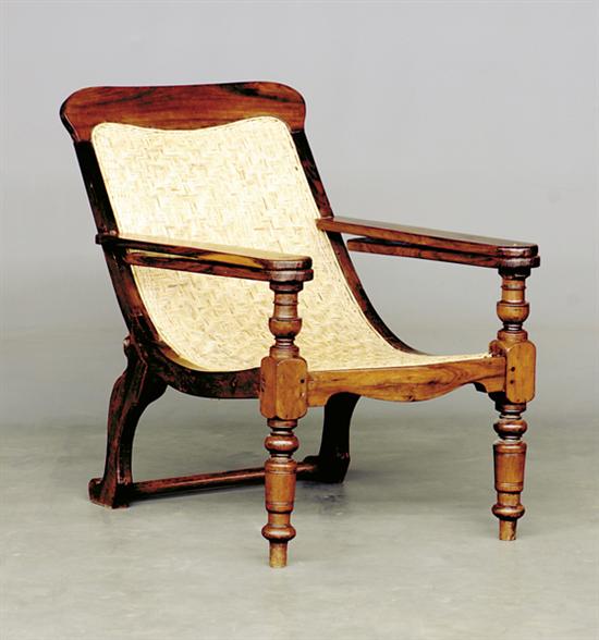 Appraisal: British Colonial rosewood and cane plantation chair mid th century