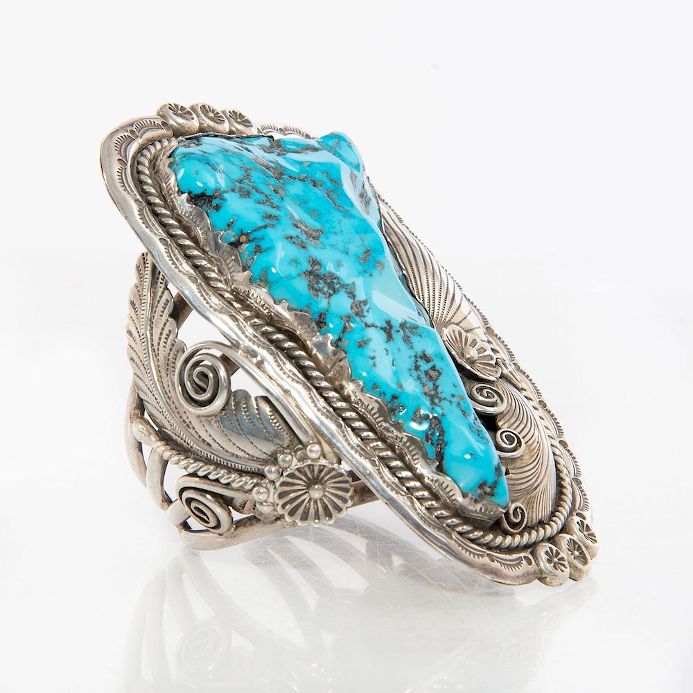 Appraisal: LARGE FRED WEEKOTY ZUNI TURQUOISE BRACELET Triangular shaped turquoise with