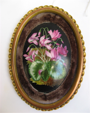 Appraisal: TWO OVAL PLAQUES one a hand painted floral porcelain miniature