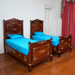 Appraisal: Pair Empire style ormolu mounted mahogany beds Pair Empire style