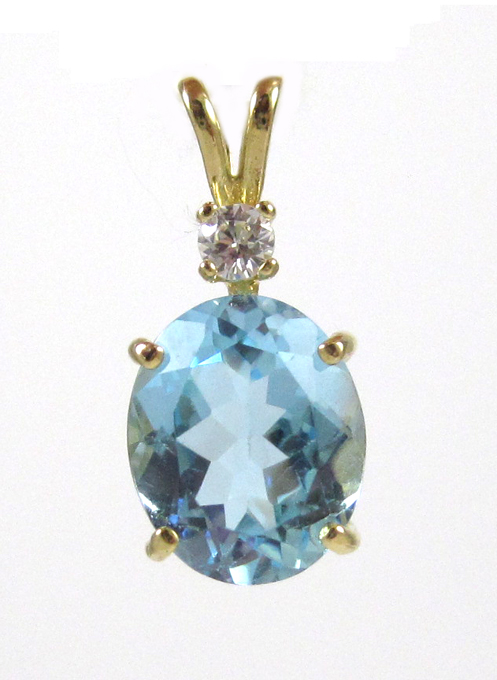 Appraisal: BLUE TOPAZ DIAMOND AND FOURTEEN KARAT GOLD PENDANT with a