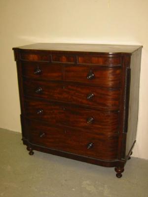 Appraisal: A VICTORIAN MAHOGANY CHEST of bowed form three secret frieze