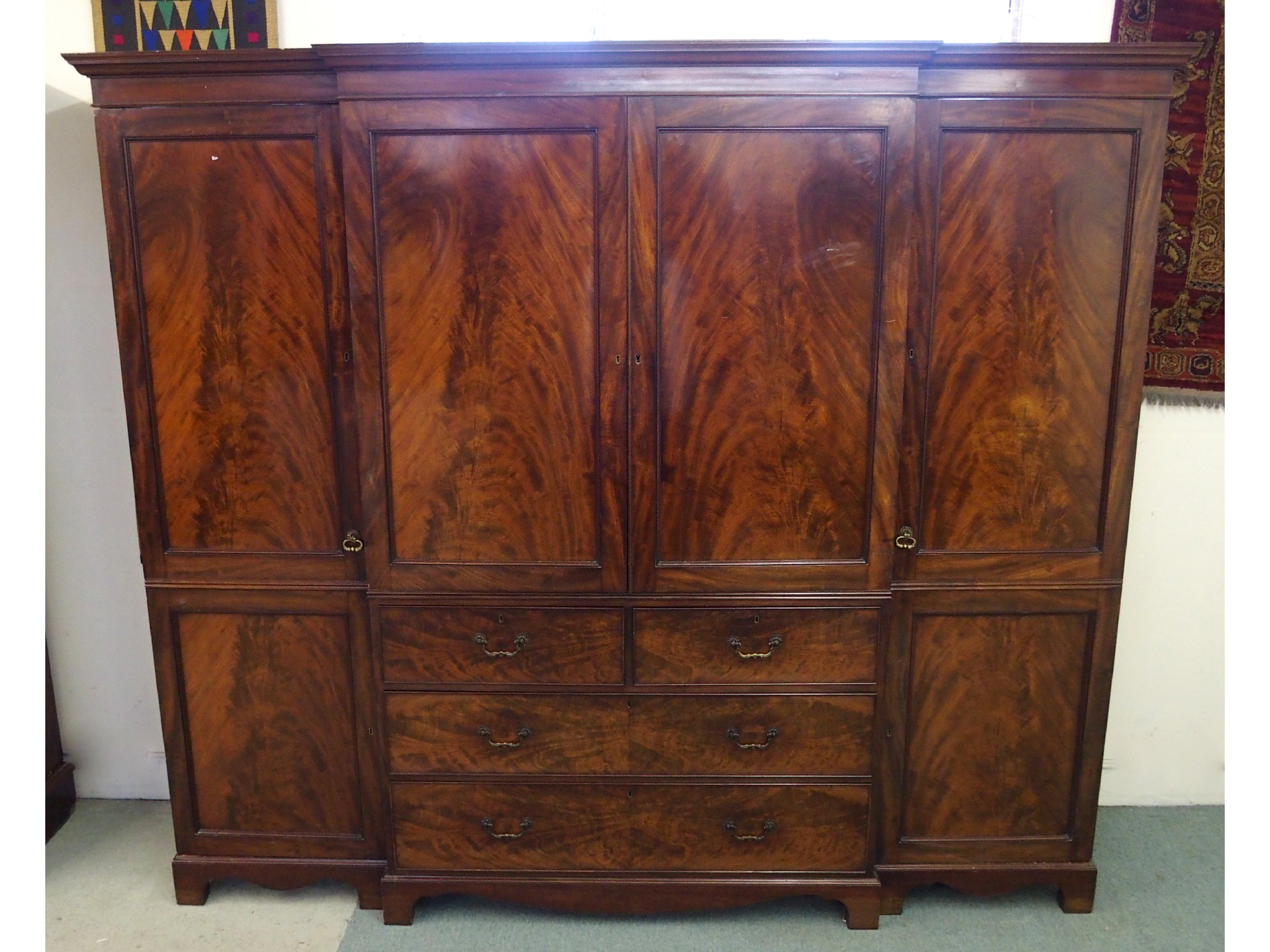 Appraisal: A th Century mahogany linen presswith a pair of doors