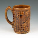 Appraisal: Morton Pottery Rockingham mug with molded parrots in brown high