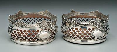 Appraisal: Pair silver plate wine coasters round with openwork bomb eacute