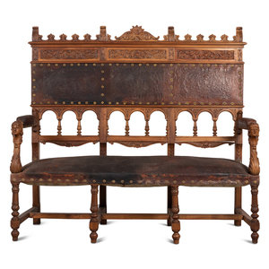 Appraisal: An Austrian Carved Walnut Bench with Tooled Leather Upholstery th