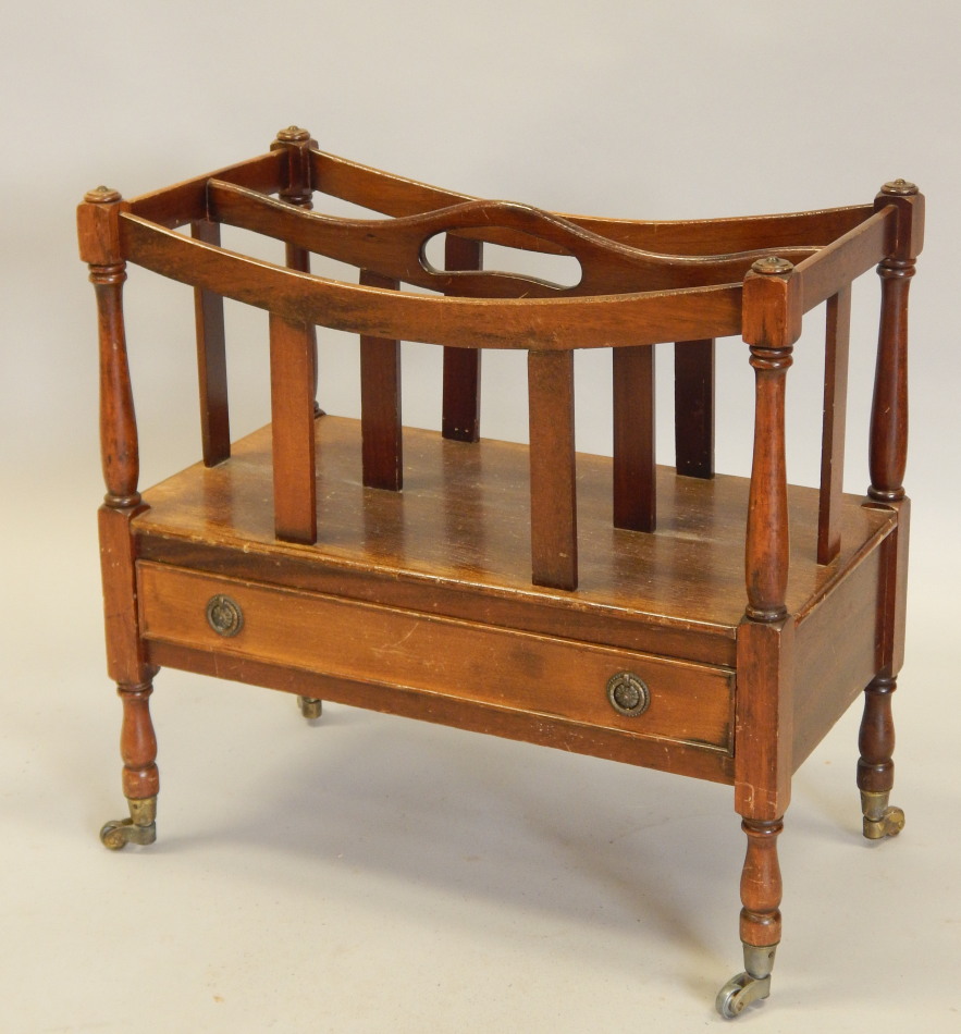 Appraisal: A reproduction mahogany two division Canterbury with a frieze drawer