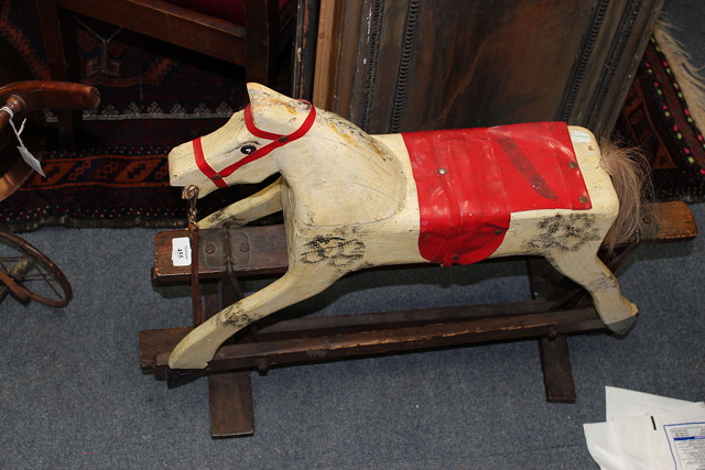 Appraisal: AN OLD SMALL ROCKING HORSE approximately long overall