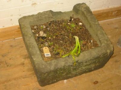 Appraisal: A YORKSHIRE GARDEN TROUGH of rough hewn oblong tapering form