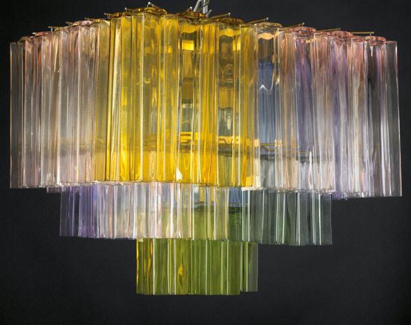 Appraisal: DANTE CERZA Large chandelier with interlocking multi-colored glass components suspended