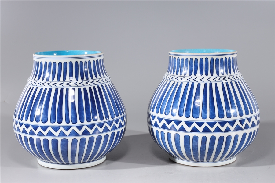 Appraisal: Pair of Chinese blue and white porcelain vessels with repeating