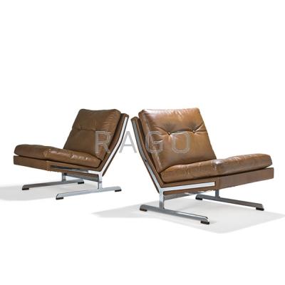 Appraisal: DANISH Pair of lounge chairs s Chromed steel leather rosewood