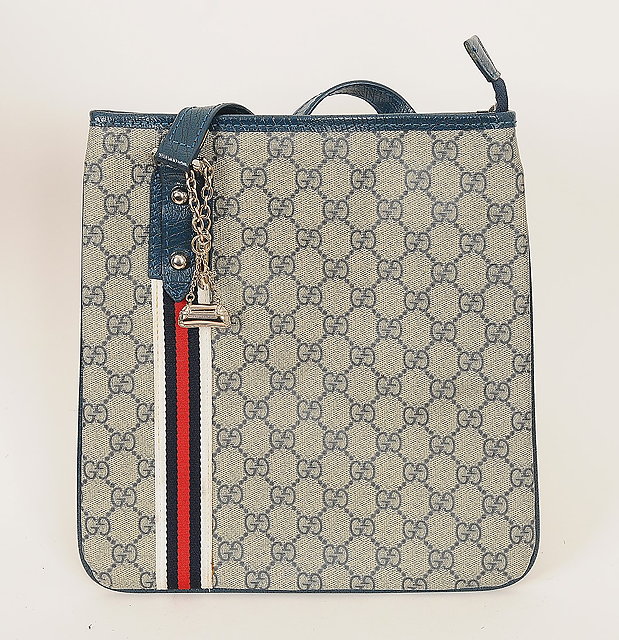 Appraisal: A Gucci messenger bag GG monogrammed canvas design blue leather