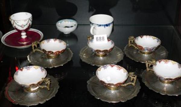 Appraisal: A set of Turkish silver and porcelain coffee cups and