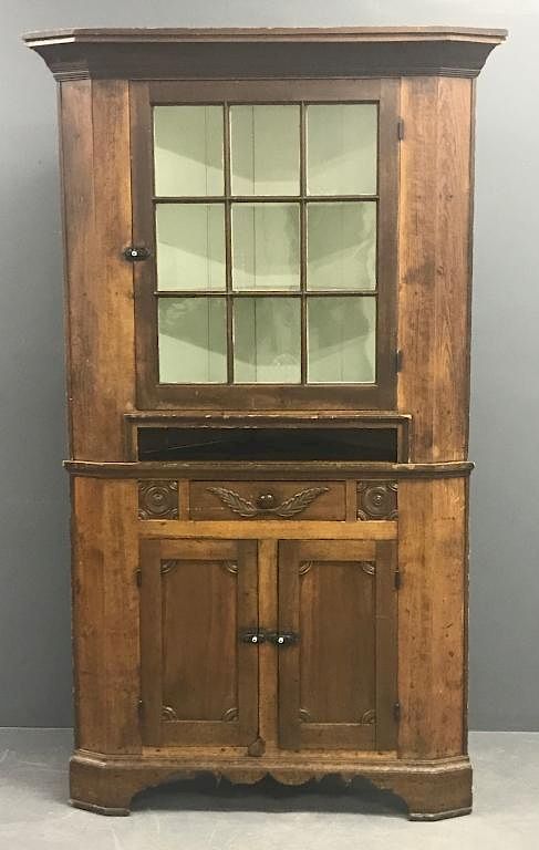 Appraisal: Pennsylvania Pine Corner Cupboard Pennsylvania pine two-piece corner cupboard circa