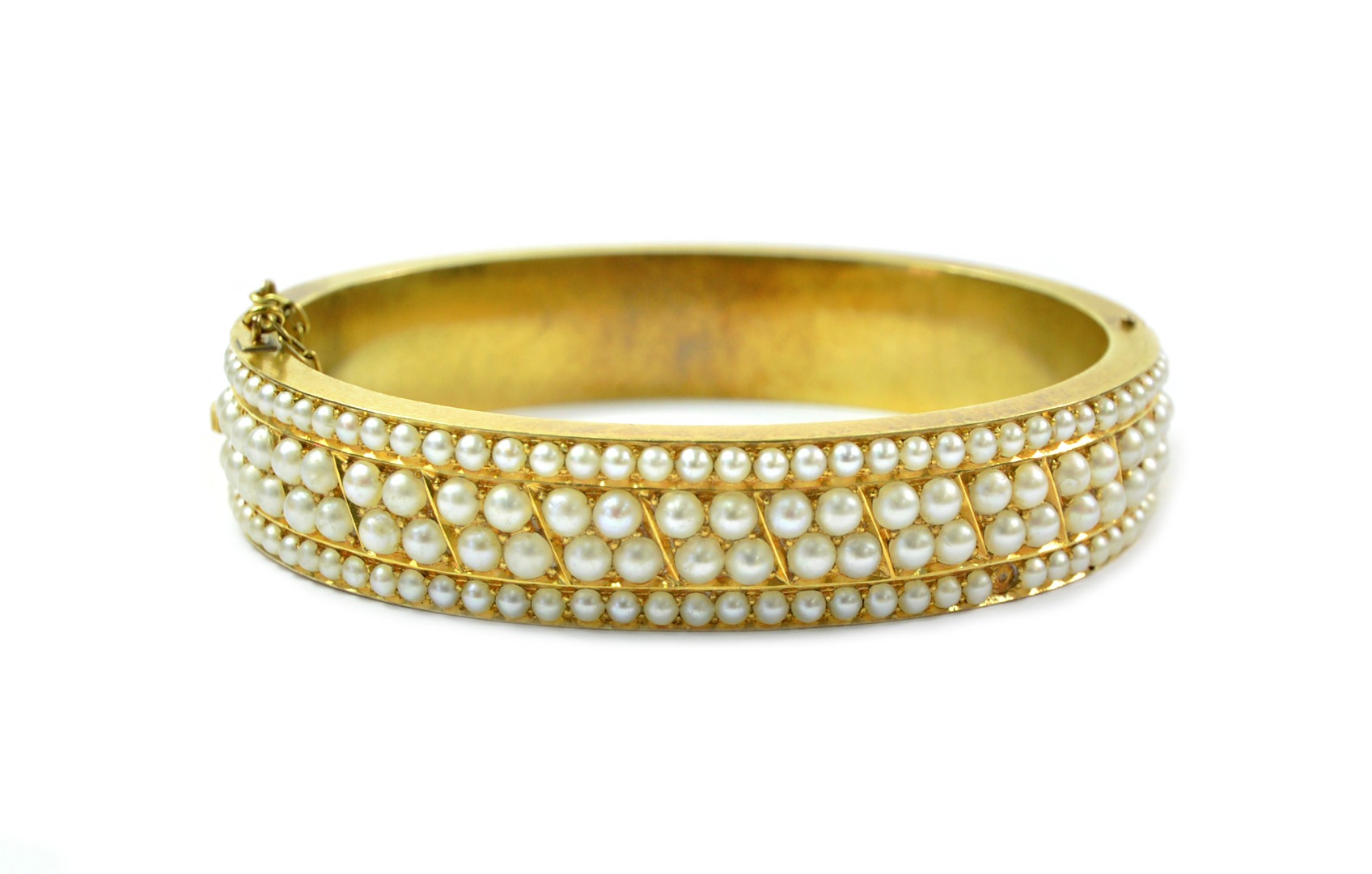 Appraisal: A late Victorian gold and seed pearl hinged bangle g