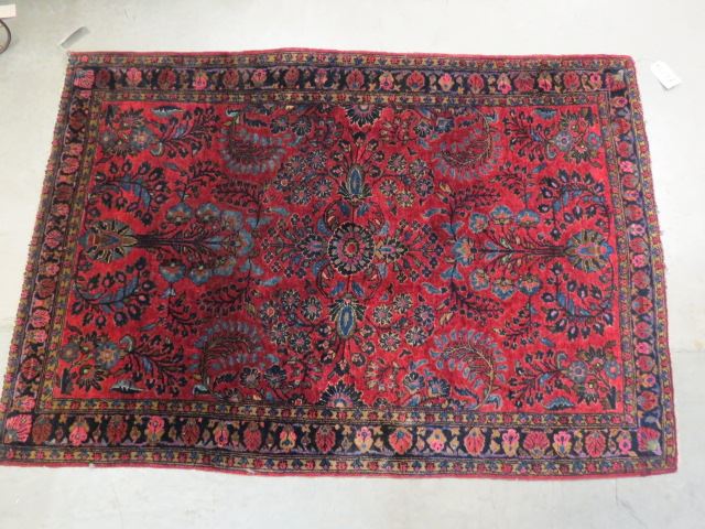 Appraisal: Sarouk Persian Handmade Rug elaborate floral on rich burgandy field