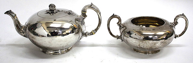 Appraisal: A VICTORIAN SILVER TEAPOT with a melon knop and scrolling