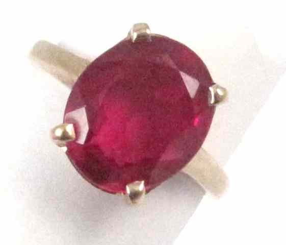 Appraisal: RUBY AND FOURTEEN KARAT GOLD SOLITAIRE RING set with an