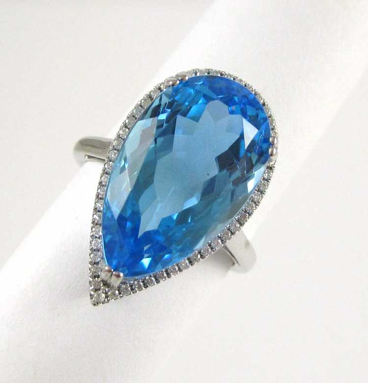 Appraisal: BLUE TOPAZ DIAMOND AND FOURTEEN KARAT GOLD RING The white