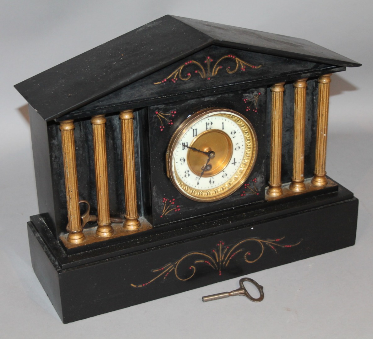 Appraisal: A Victorian black slate mantel clock centred by a cm