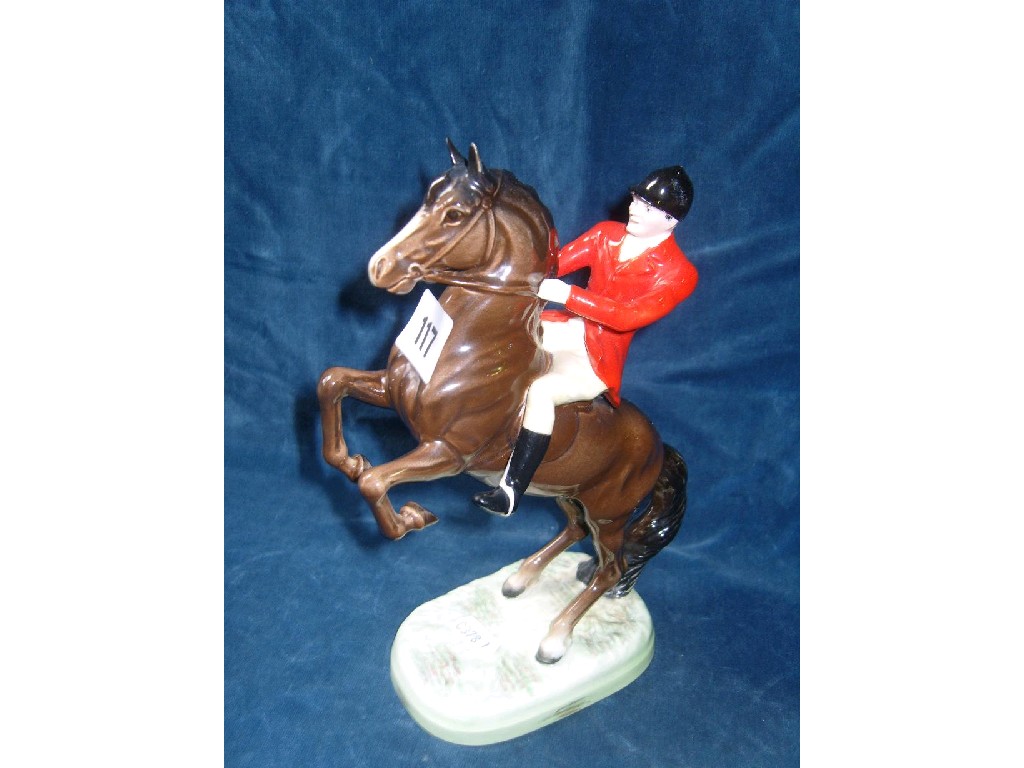 Appraisal: A Beswick huntsman on a rearing horse red jacket number